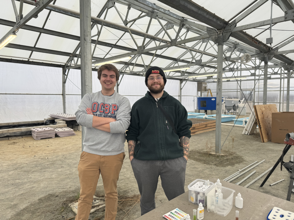 Rowan+University+students+Brendan+Bermingham+and+Isaac+Linsk+with+the+aquaculture+system+at+the+West+Farm+campus.+%28Gianna+Malgieri