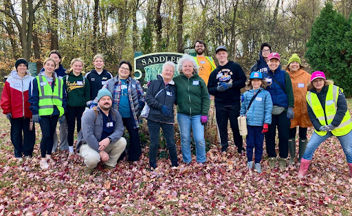 Volunteers of the Saddler’s Woods stand together after a clean-up event on Nov. 16, 2024. (Photo courtesy of Lorraine Prince).