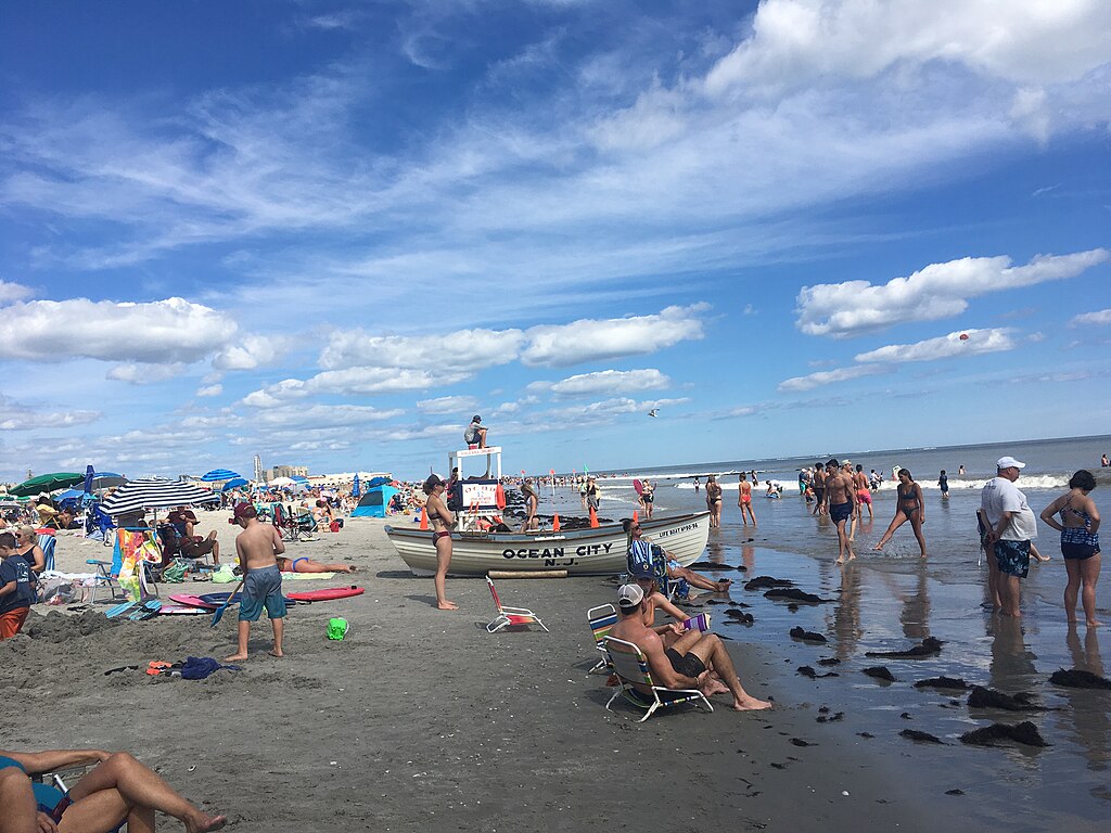 Beachgoers enjoy the sun and sand at Ocean City, N.J. (Photo by Dough4872, CC BY-SA 4.0 , via Wikimedia Commons)