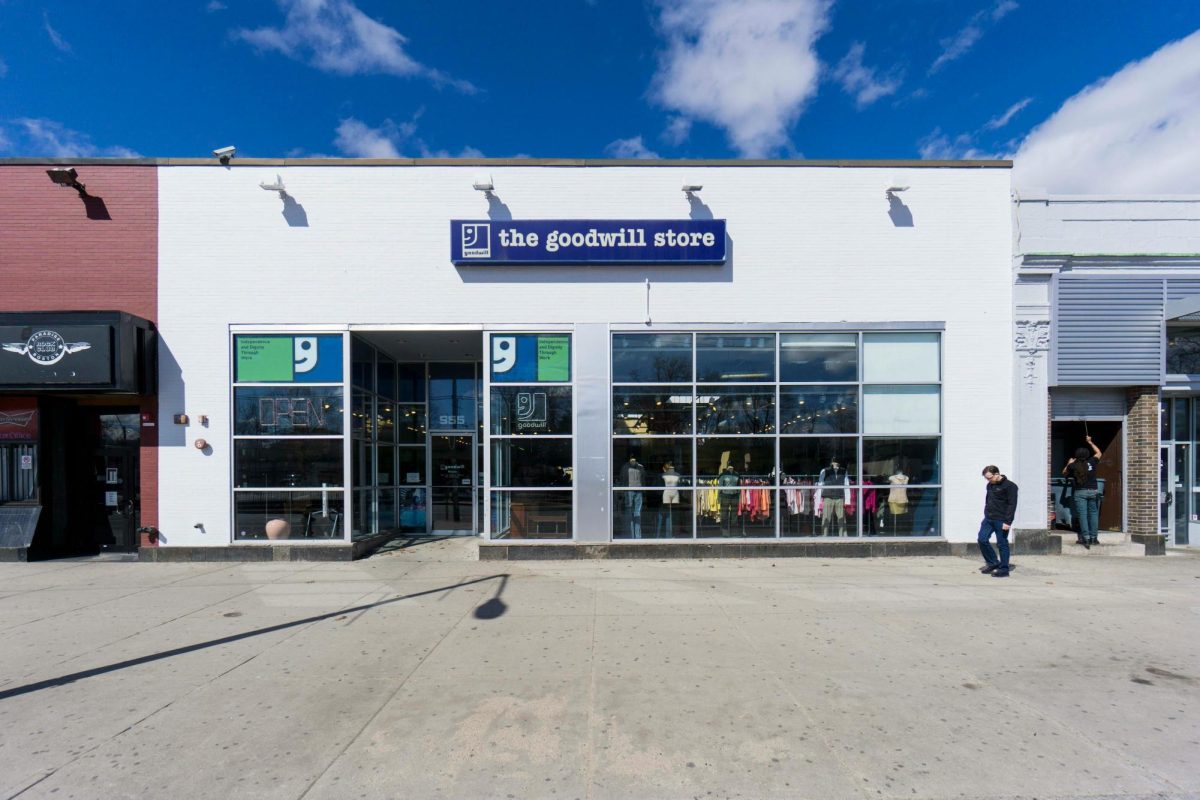 A man walks by a Goodwill store in Boston, MA. (Max Rottersman via Pexels)
