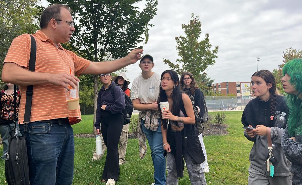 Environmental Science professor Dr. Daniel Duran leads Rowan University students on a foraging walk on campus in Glassboro, NJ on Sept. 22, 2025. (Anthony Coccaro)