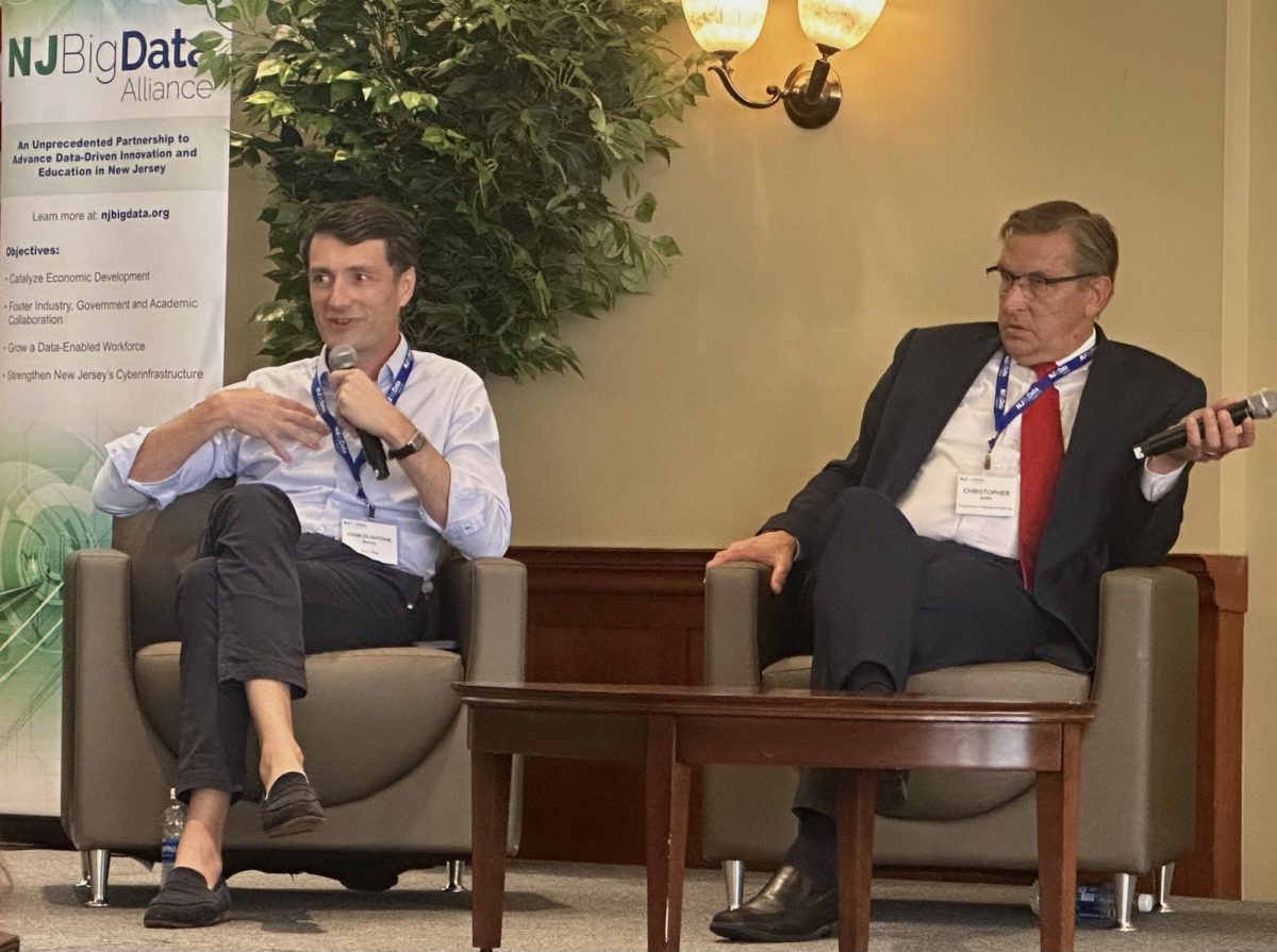 Charles Antoine Beyney (left), the founder and president of DataOne, a data center currently under construction in Vineland, speaks on a panel at the New Jersey Big Data Alliance conference at Rowan University on May 20, 2026. (Hayden Fugee/South Jersey Climate News)